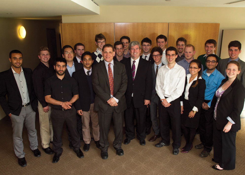 Principal Daniel Woolf, 6th from left, beside Glen Murray, Ontario's Minister of Training, Colleges and Universities, with Institute students.